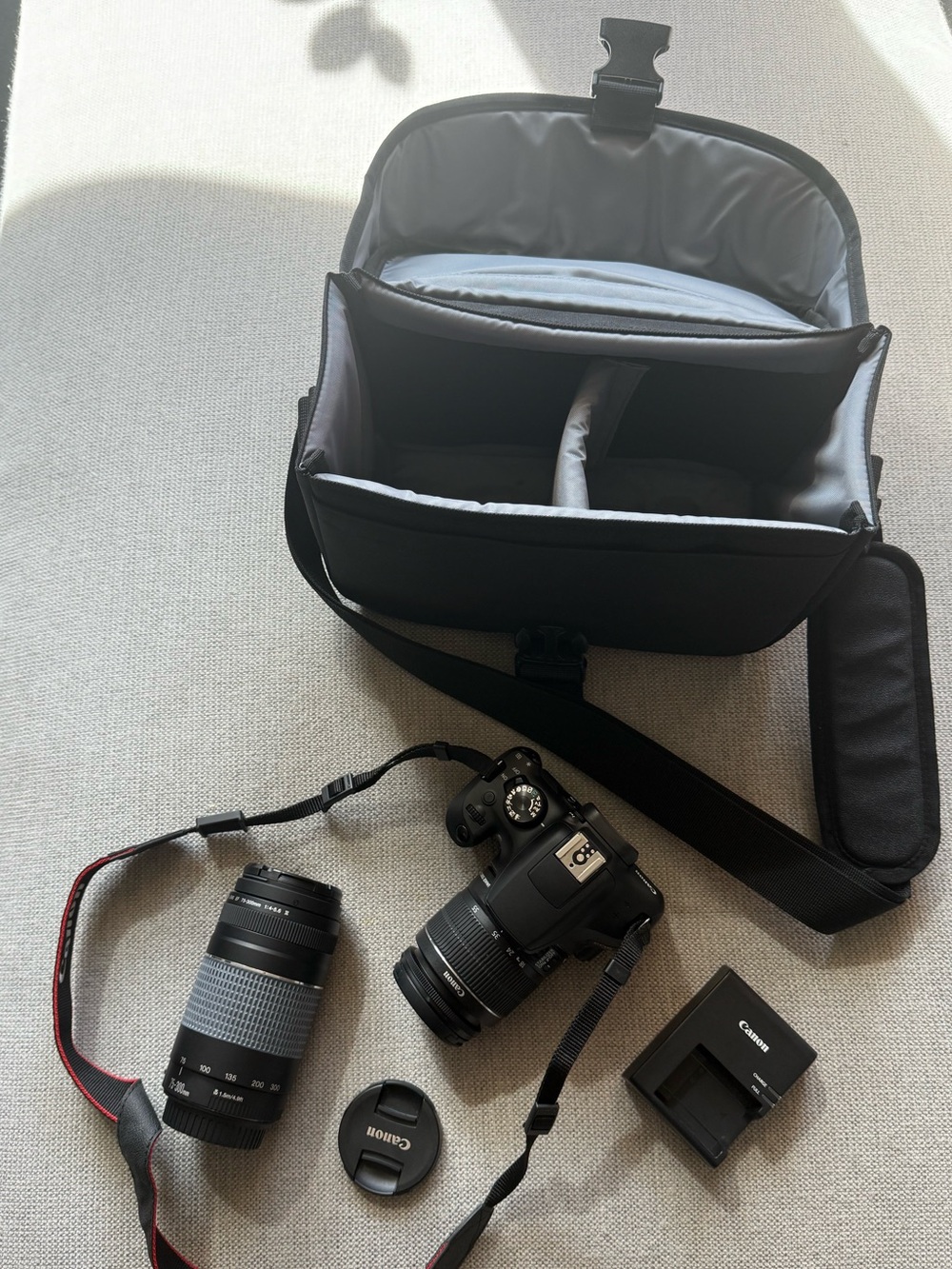 Canon Black DSLR with Two Black Lenses and Padded Black Camera Bag